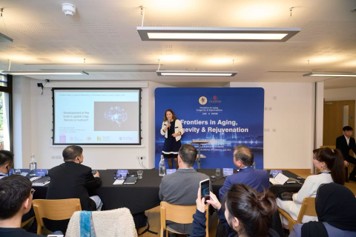 Professor May-Britt Moser speaking at the Cambridge symposium